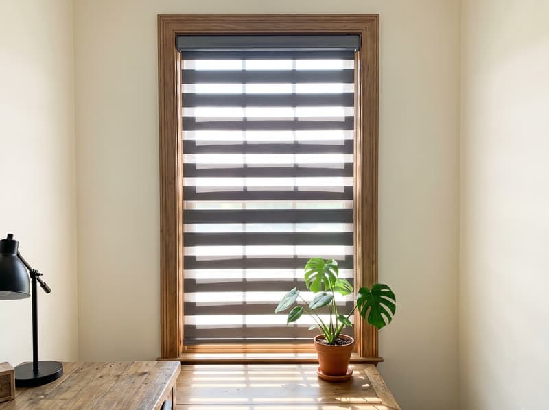 Graphite zebra shade with open bands in a Milton home office