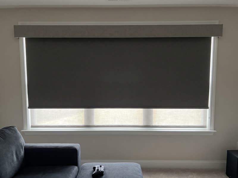 Dual shade with blackout layer lowered in a Cumming media room