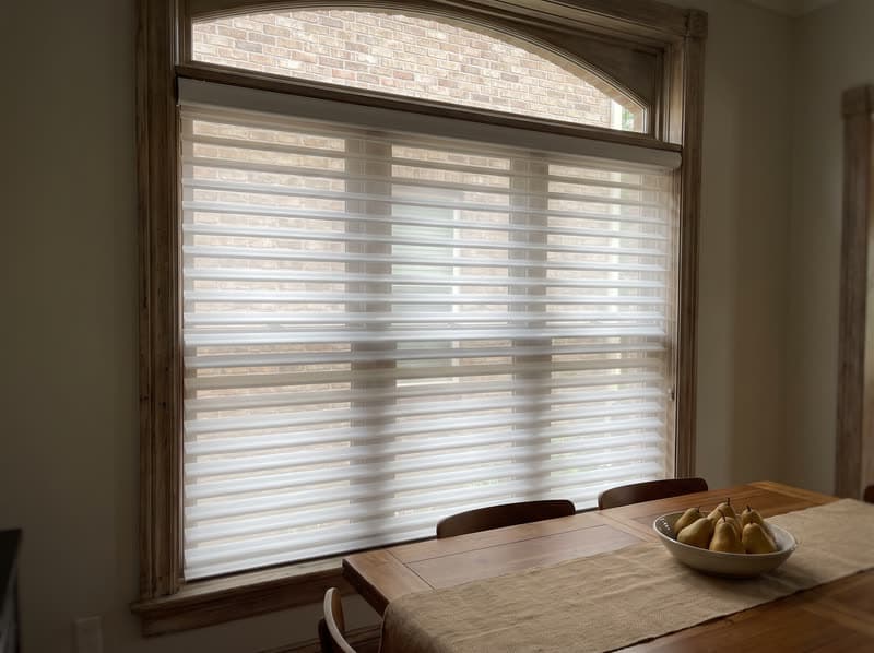 White Shangri-La sheer shade under an arched transom in Sandy Springs