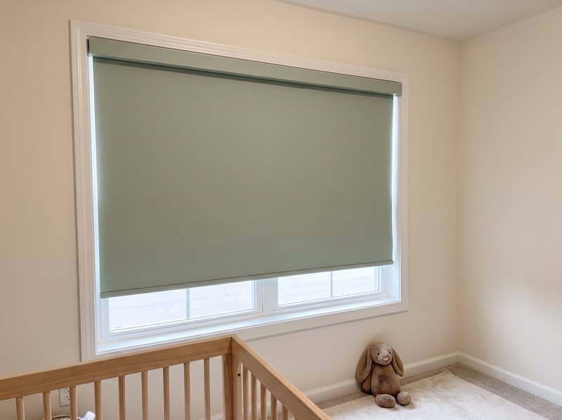 Sage blackout roller shade in a nursery of a Cumming townhome