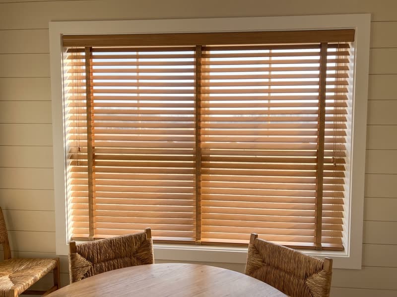 Faux wood blind on a breakfast nook window in a modern farmhouse in Canton