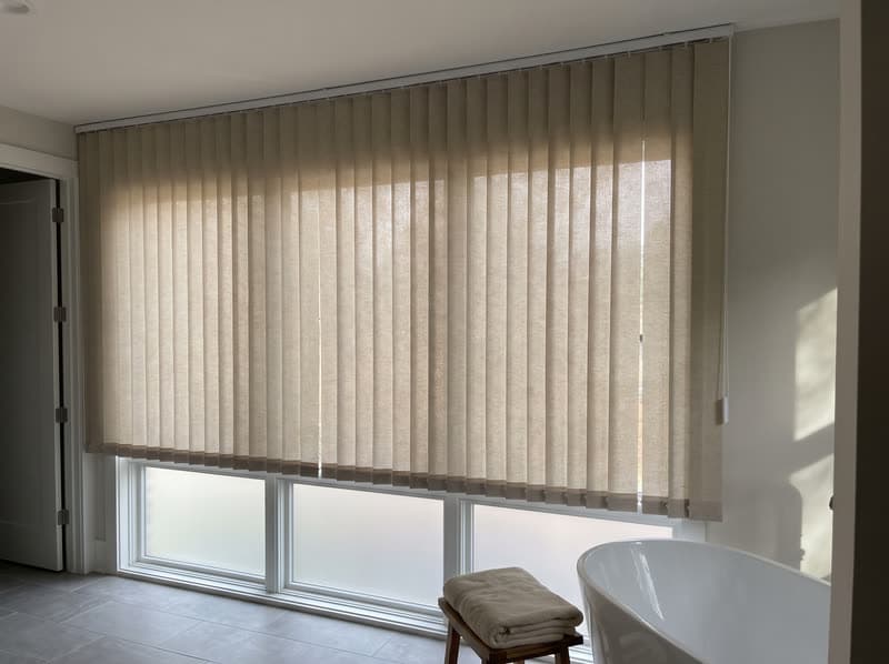 Vertical blind on a bathroom window in a new build in a modern subdivision in Sandy Springs