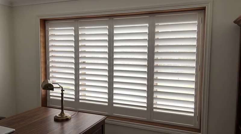 Composite shutters on a home office window in a traditional two-storey house in Roswell
