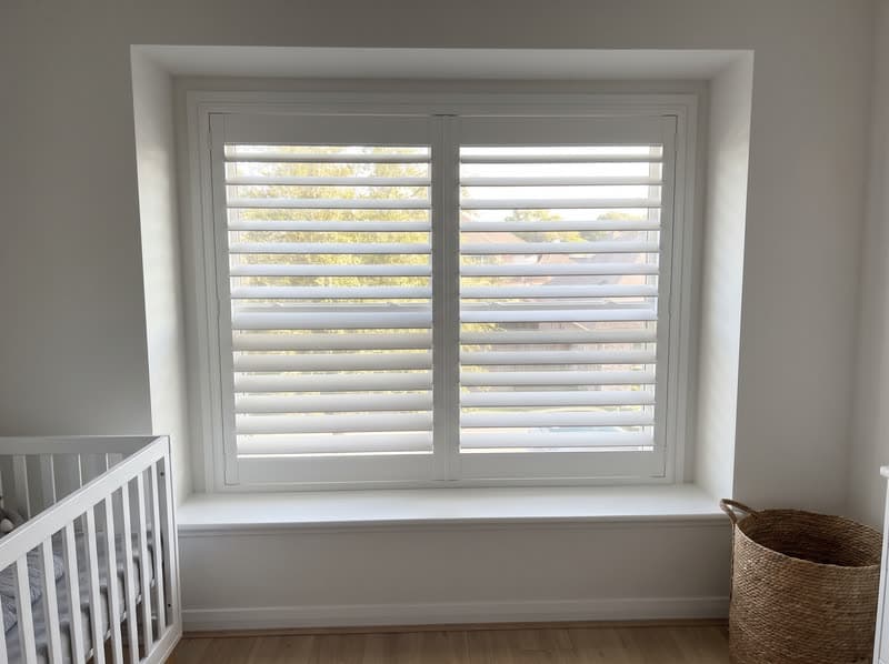 Composite shutters on a nursery window in a new build in a modern subdivision in Cumming