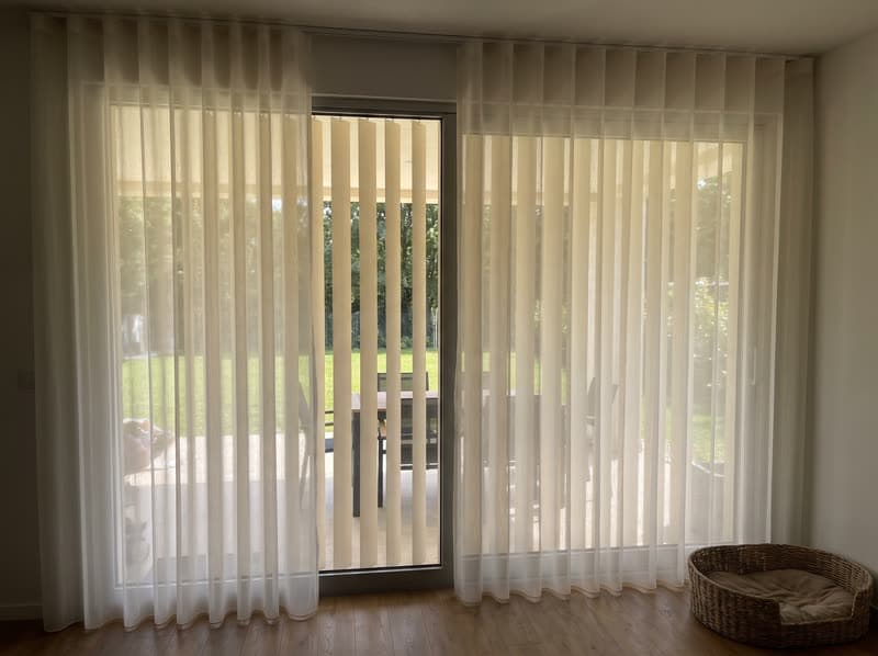 Ivory vertical sheer dream curtain on a sliding glass door in Johns Creek